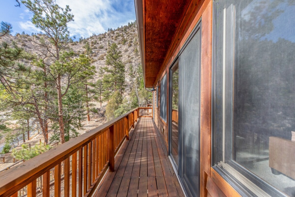 The deck running alongside the lodge with views down the canyon
